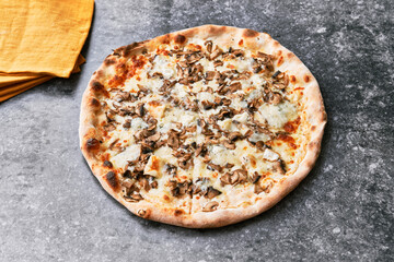  Delicious mushroom italian pizza on a concrete surface