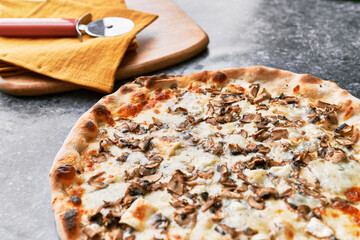  Delicious mushroom italian pizza on a concrete surface