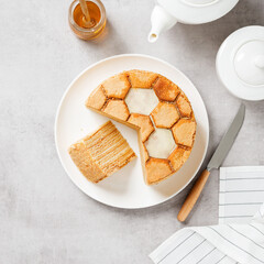 Layered honey cake Medovik. Traditional russian cuisine. Top view. Light gray background.	