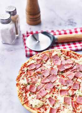  Delicious prosciutto italian pizza on a marble surface