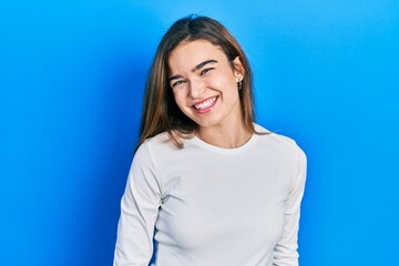 Young caucasian girl wearing casual clothes with a happy and cool smile on face. lucky person.