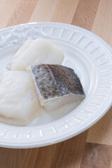 Three servings of fresh cod on a plate