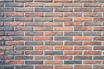 Brick wall texture with cracked tiles and cement. Classic brickwall surface background
