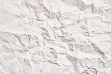 White crumpled paper texture with wrinkles. Damaged and torn sheet