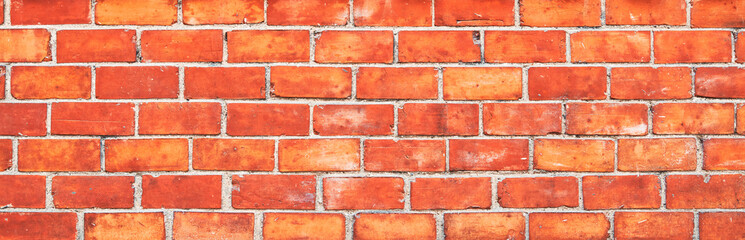 Obraz premium Brick wall texture with cracked tiles and cement. Classic brickwall surface background