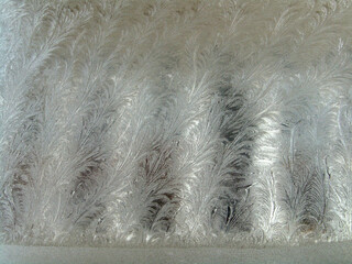 Frosty winter background photo of ice buildup on a window