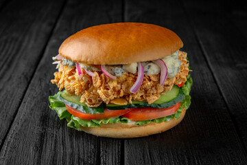 Delicious juicy burger from Brioche Bun with chicken fork or fishburger with batter in fish....
