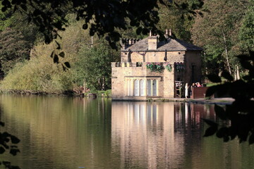 Fototapeta na wymiar An old building by a lake