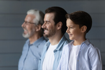 From childhood to retirement. Family dynasty of 3 different age male members stand in line...