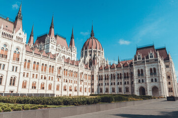 Fototapeta na wymiar Hungarian Parliament building in Budapest at the daylight. Gothic architecture exterior. Tourist destination. 