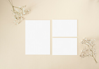 Wedding invitation set mockup with white gypsophila flowers
 