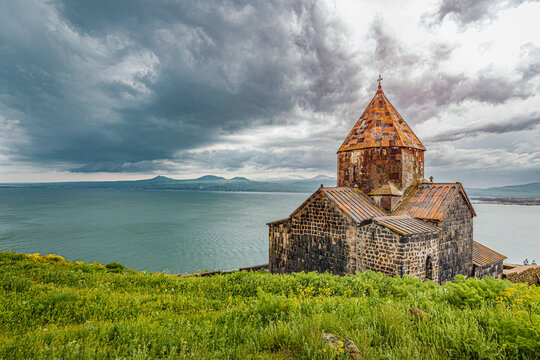 Famous Sevanavank Monastery on the shore of Lake Sevan is the main religious and tourist attraction of Armenia in stormy weather