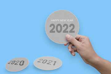 Creative idea hand holding paper happy new year 2022