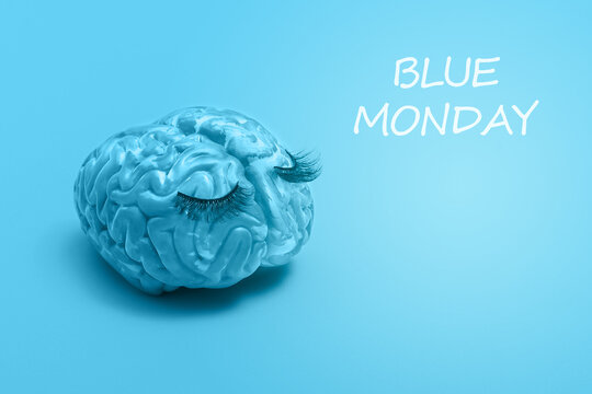 Creative blue Monday concept with copy space. Sad blue human brain on a blue background.