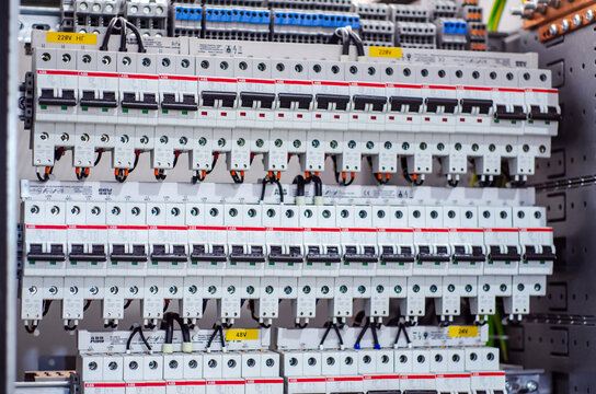 Kyiv, Ukraine - October 20, 2021: Installing ABB circuit breaker in distribution board