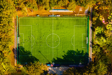 Aerial view of an empty soccer football field in forest - 467682335