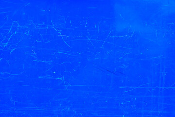 The metal sheet is blue. There are scratches on the surface. Background. Texture.
