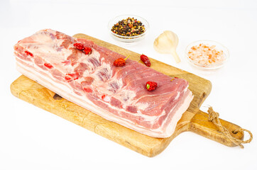 Piece of raw pork belly, fresh meat for cooking. Studio Photo
