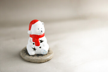 cute white polar bear in a hat and scarf for design of greetings, postcards. background for any purposes. cute polar bear for print design