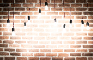 Brick wall in loft interior with Christmas lights background, blank empty frame with copy space