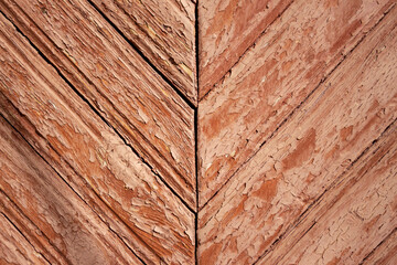Texture of old wooden boards painted with red paint