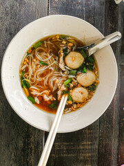 Thai food. Noodle soup with meatball and vegetables