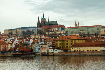 Fototapeta na wymiar City castle and Charles bridge, Prague in cloudy weather