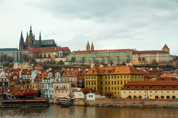 Obraz premium City castle and Charles bridge, Prague in cloudy weather