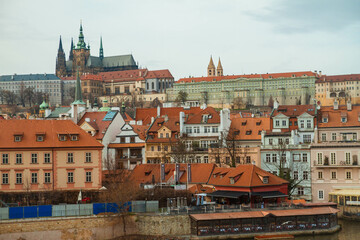 Naklejka na ściany i meble City castle and Charles bridge, Prague in cloudy weather