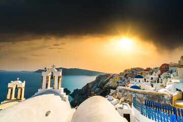 Scenic sunset view of Oia village at Santorini island. Greece