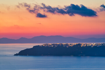 Oia village viewed from distance at sunset. Santorini Island. Greece
