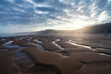 Watergate Beach at sunrise in Cornwall. UK