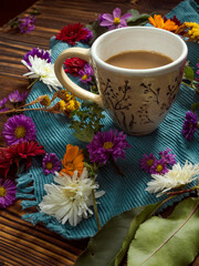 Fototapeta na wymiar Coffee cup and flower petals.