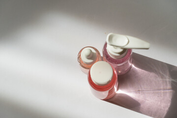 Elegant Cosmetic Bottle in Soft Pastel Tones on White Background