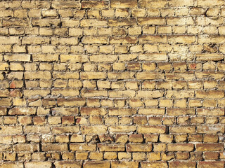 Old yellow brown brick wall background texture. Brick wall of historical bricks.