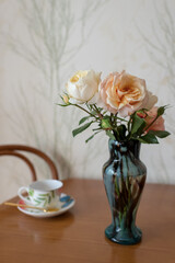 Photography to theme beautiful bouquet roses in vase on wooden table