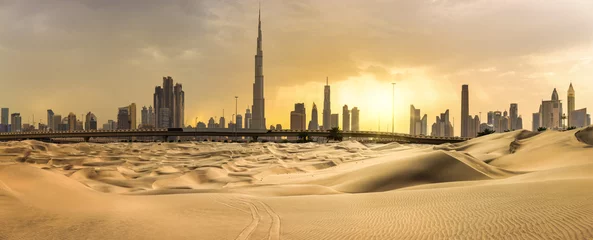 Zelfklevend Fotobehang Dubai Dubai downtown skyline panorama at sunset with desert sand, United Arab Emirates