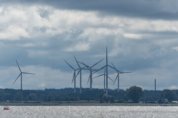 Ecological wind farm. Windmills that produce electricity. Renewable energy sources.