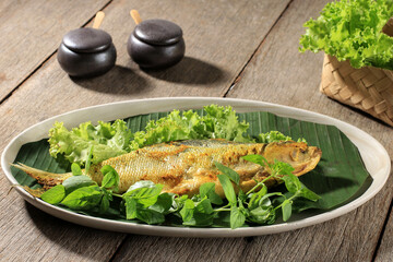 Raw Bandeng Presto Juwana, Milkfish Cooked with Pressure Cooker, Served with Chilli Paste (Sambal) and Fresh Vegetable, Copy Space for Text