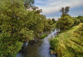 Fototapeta na wymiar autumnal river near the forest