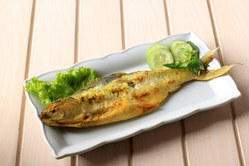 Bandeng Presto Juwana, Milkfish Cooked with Pressure Cooker, Served with Chilli Paste (Sambal) and Fresh Vegetable