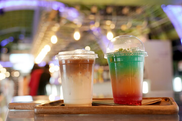 Fruity juice mixing syrup soda and ice in the coffee shop.  