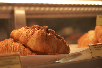 Fresh Baked Croissants in glass cabinet.    