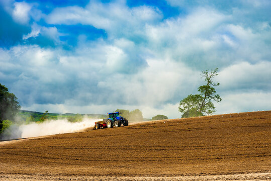 Tractor ploughs a field on a Yorkshire farm