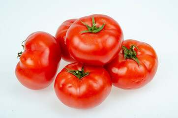 Red, dark pink ripe tomatoes isolated on white background. Studio Photo
