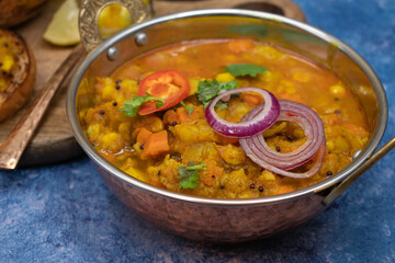 Vegetarian potato and mixed vegetables curry in indian style bowl