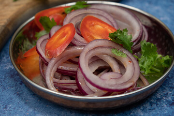 Sliced pickled onions and hot peppers