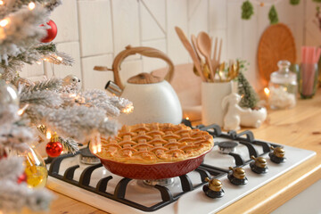 Christmas white kitchen in the Scandinavian style. Christmas decorations. Breakfast, Christmas traditions, pie, tree