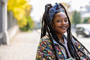 Portrait of confident young woman outdoors 
