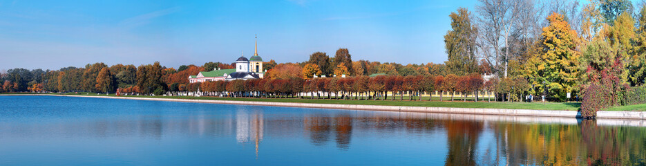 Panoramic wide angle view of pond reflections of historic Kuskovo buildings and sunny autumn park - obrazy, fototapety, plakaty